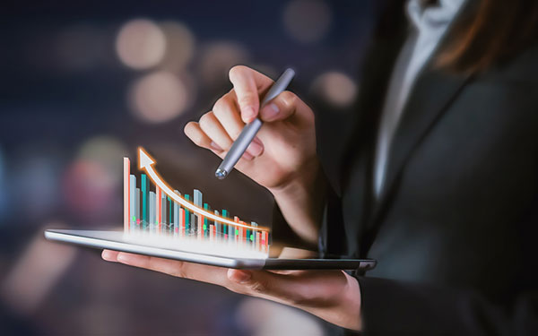 Woman using a tablet that shows a rates graphic