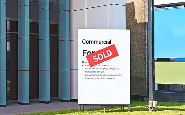 Commercial building with a sold sign