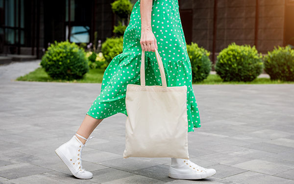 A woman carrying a shopping bag